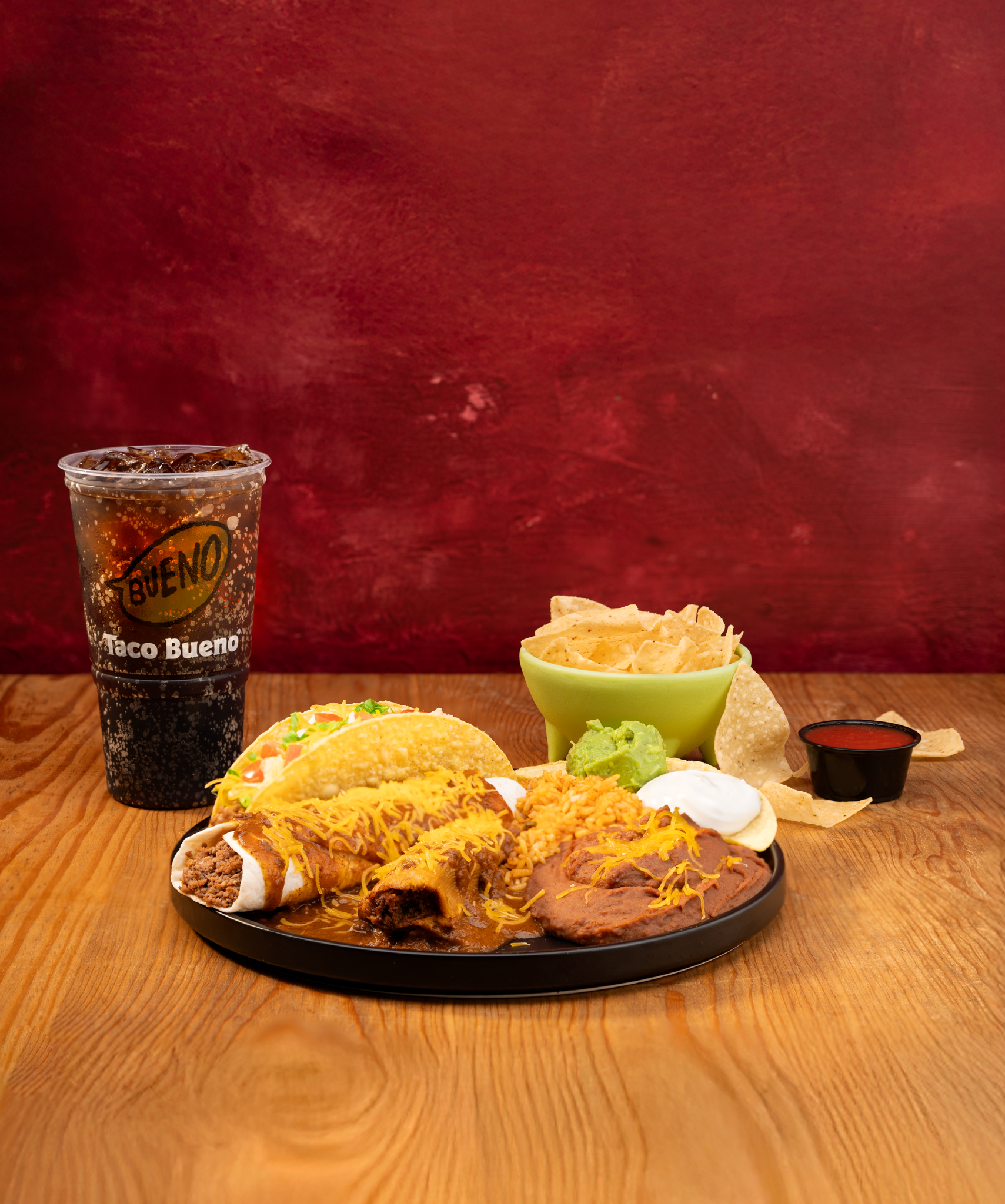 Taco Bueno Tamales Are Back combo platter with tamales, taco, rice, beans, chips, salsa, and drink